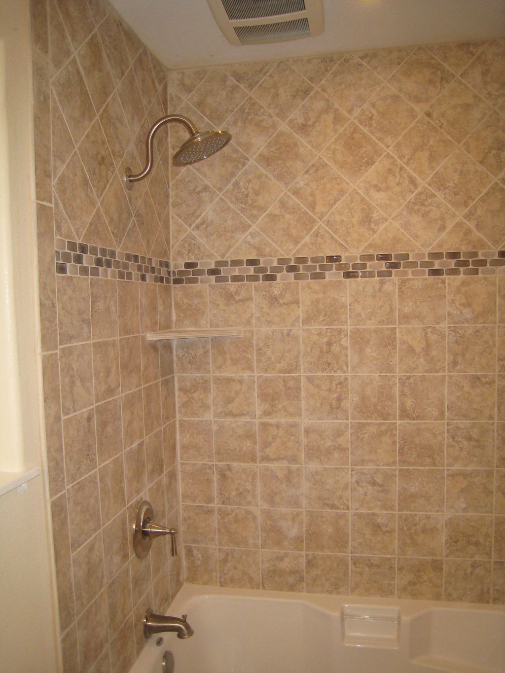 Custom tile tub surround by DMJ services.  Straigh