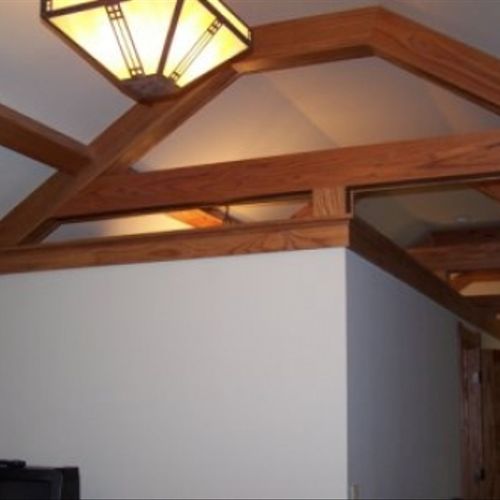 Vaulted ceiling and oak beams in an attic renovati