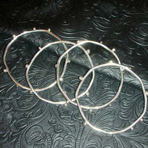 Sterling silver, hand wrought "bump" bangles, to w