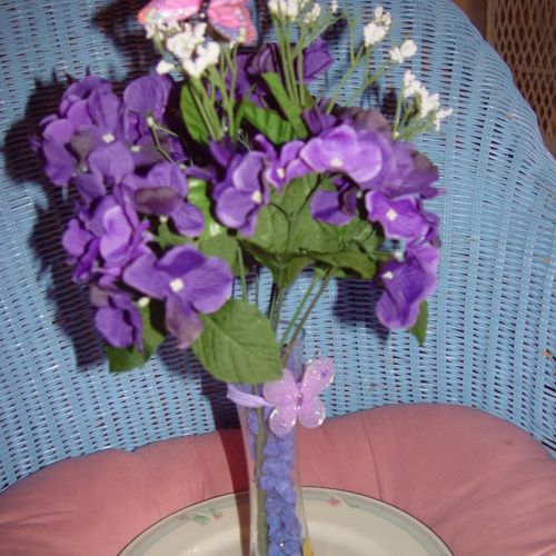 Our purple silk flower arrangement can be used to 