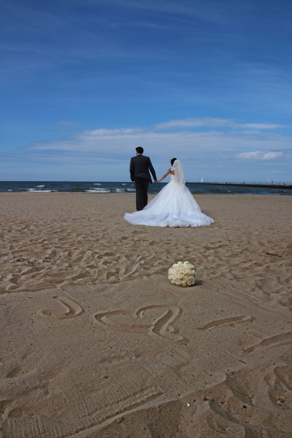 Bride and groom walking off together at the end of