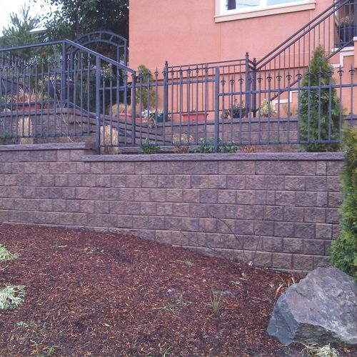 Retaining wall with iron fence