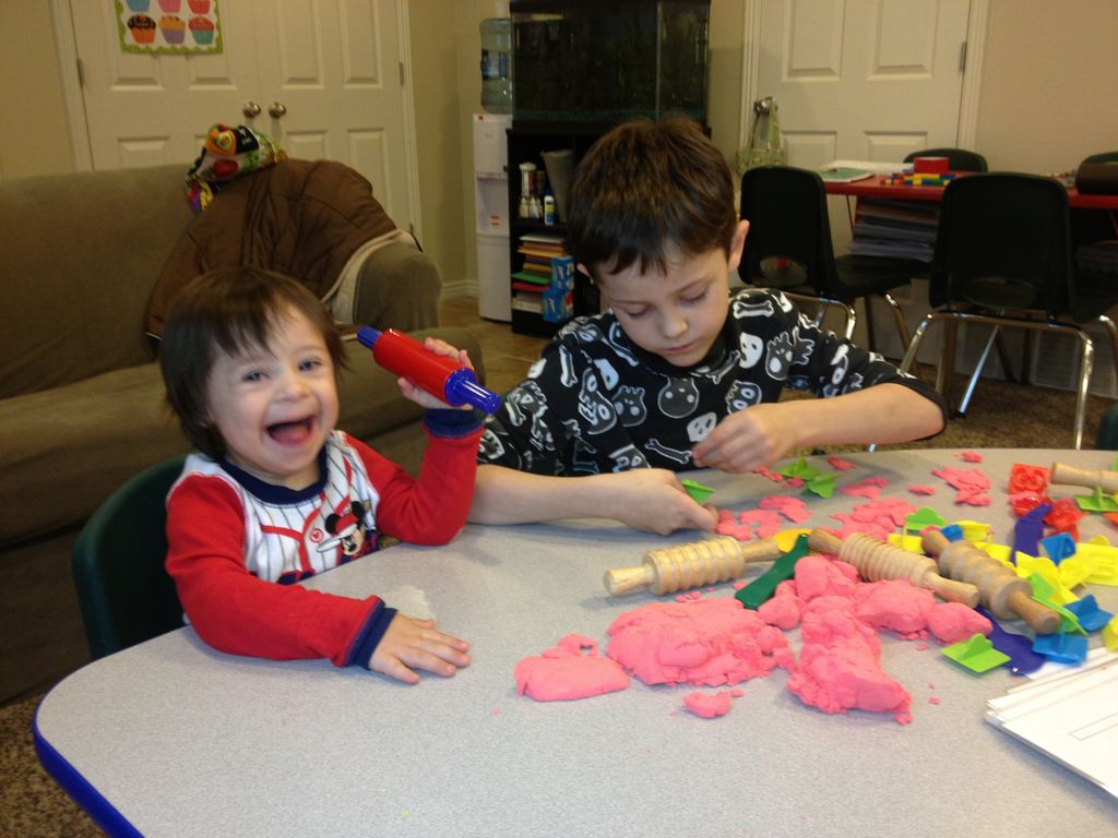Having sensory fun with playdough.