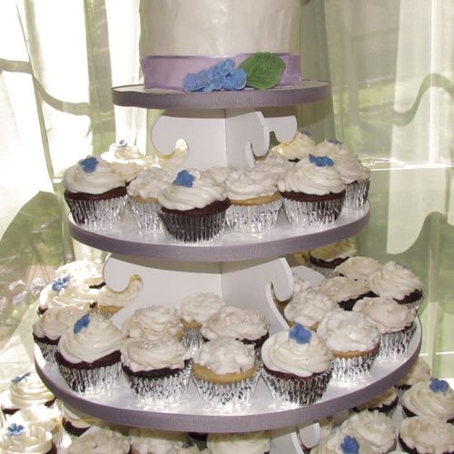 Cupcake towers with a cake topper make a statement