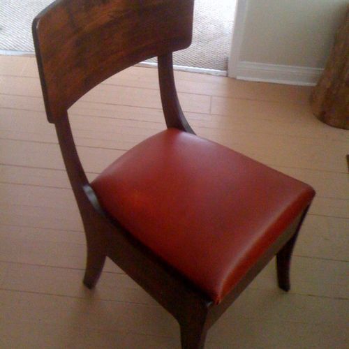 The Bogart dining chair.
Red leather seat cushion.