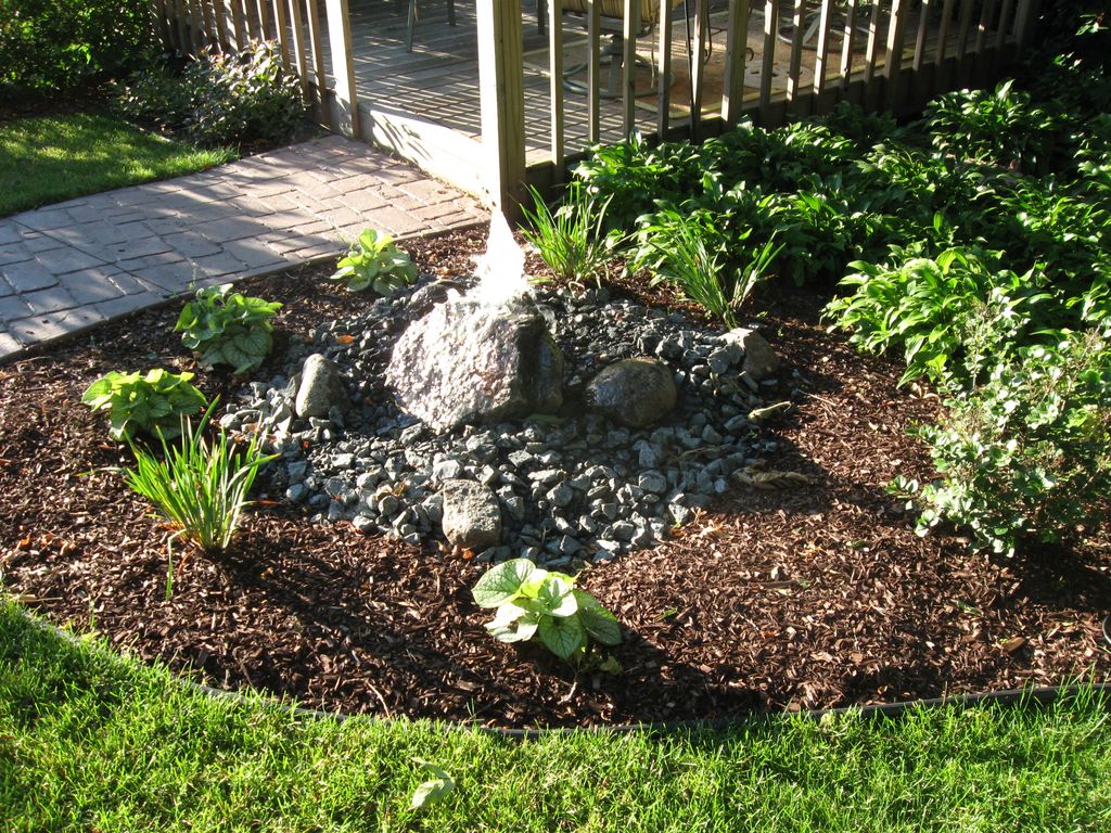 Bubbling rocks like this one in Edina, MN add a ch