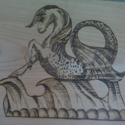 Seahorse wood burning detail, as requested by tree