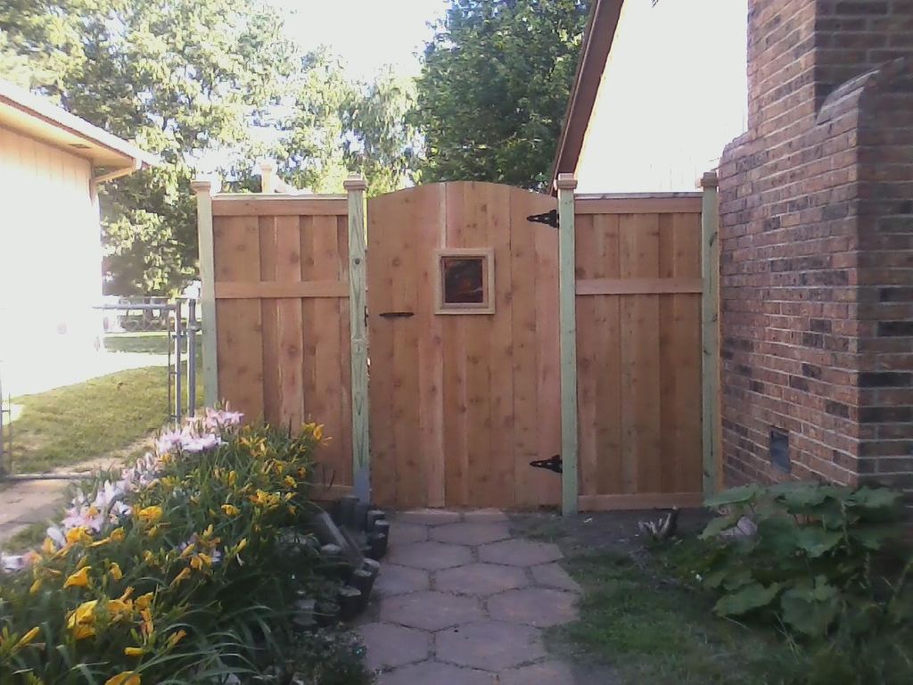 Custom gate with stained glass window.