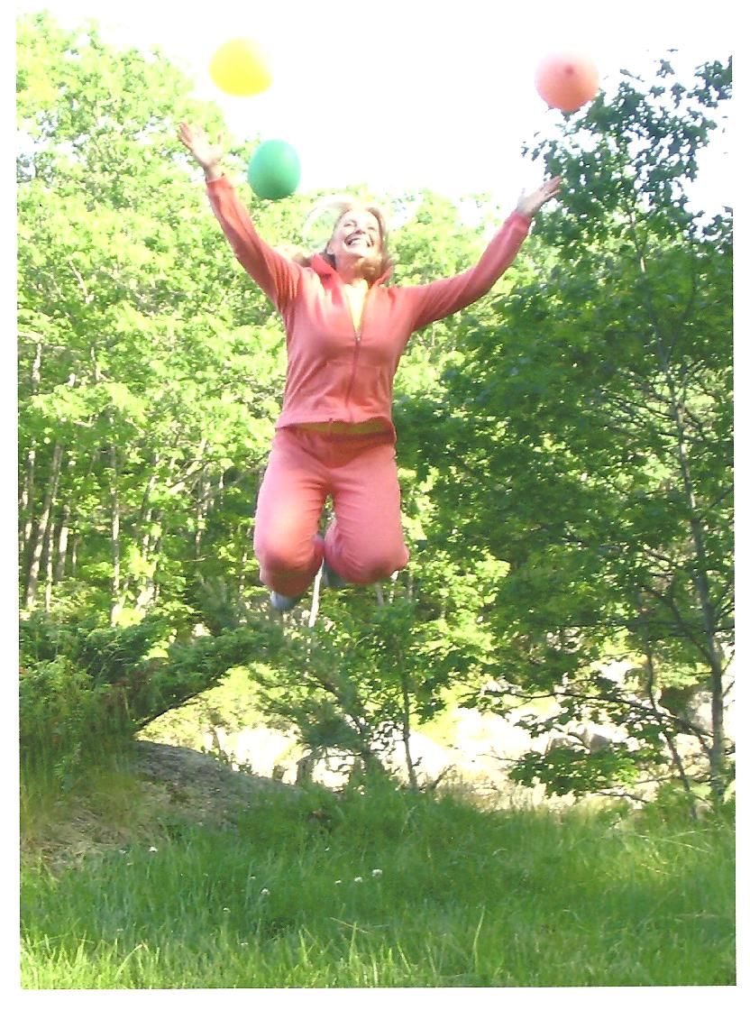 Happiness Coach and Speaker Nira Berry jumping for