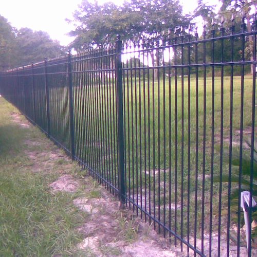 A 200 foot wrought fence with a 20 by 7 foot gate 