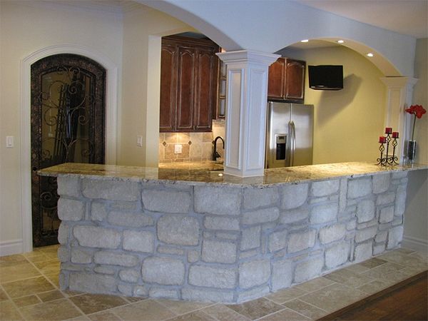 CULTURED STONE SERVING WALL WITH GRANITE COUNTERTO