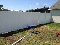 VINYL FENCE INSTALL IN PROCESS.