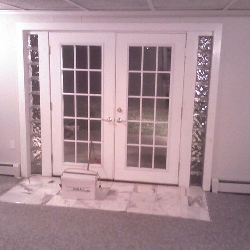 French doors with glass block & Marble entry way