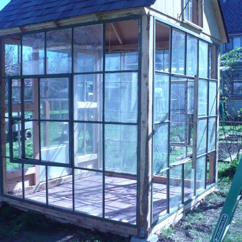 GREENHOUSE BUILT OF JUNIPER AND RECYCLED WINDOWS