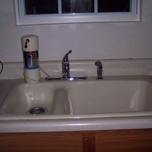 We added a cast iron sink, faucet and a window to 