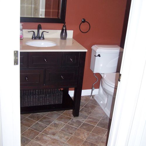 Bath remodel, vanity sink, toilet, tile flooring