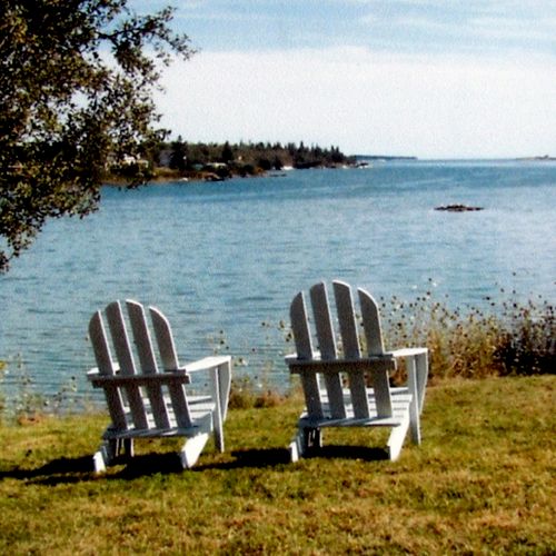 Open fields and wide views of Penobscot Bay at the