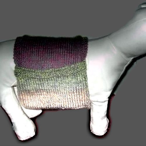 A custom hand knit dog sweater called the backpack