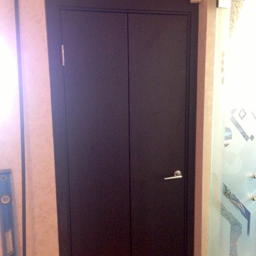 plain black bi-fold door, Brooklyn, NY