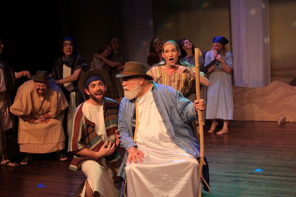 Performing on stage, singing in musical.