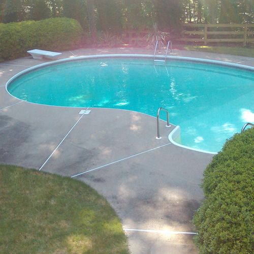 Before picture of a pool we pressure washed.
