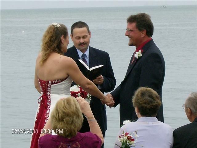 Rev. Tom presiding over a ceremony for a couple on