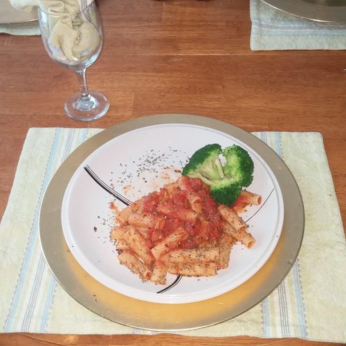 Pasta with marinara sauce and broccoli.