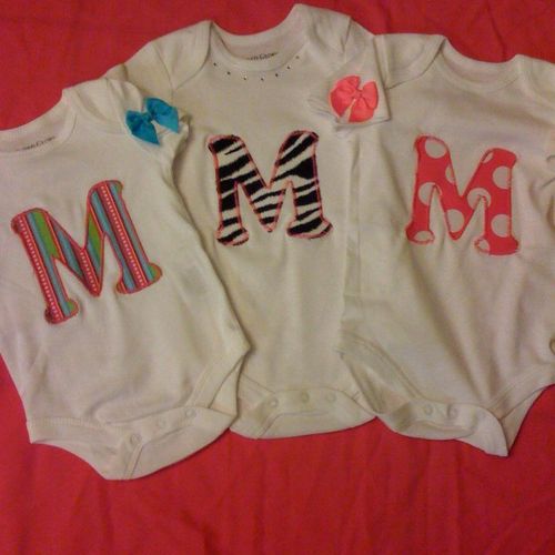 Initial onesies with rhinstones and/or bows.  $12 