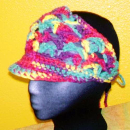 Cotton tie-back visor in open weave shell stitch. 