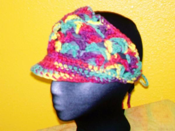 Cotton tie-back visor in open weave shell stitch. 