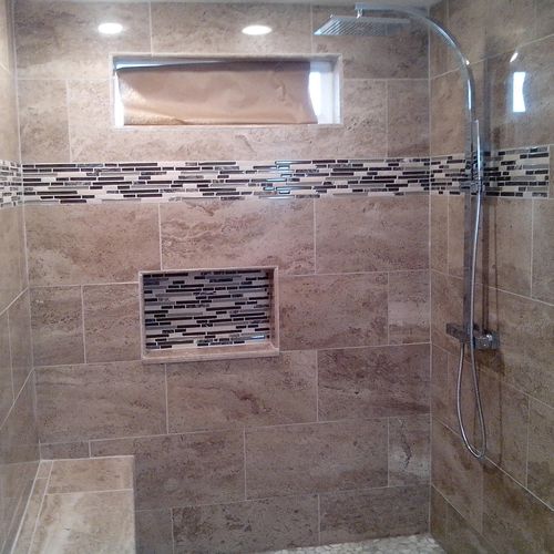 Shower Remodel with Stone tiles and bench seat wit