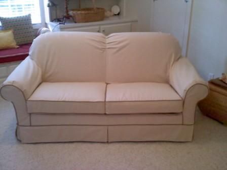 Slip covered sofa custom tailored to fit right!!!!