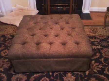 Button tufted ottoman used as a coffee table.
