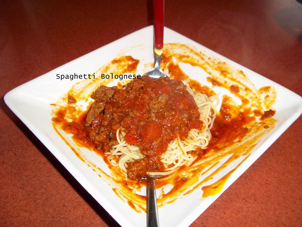 Spaghetti Bolgnase.Rich red meat sauce, with a lit