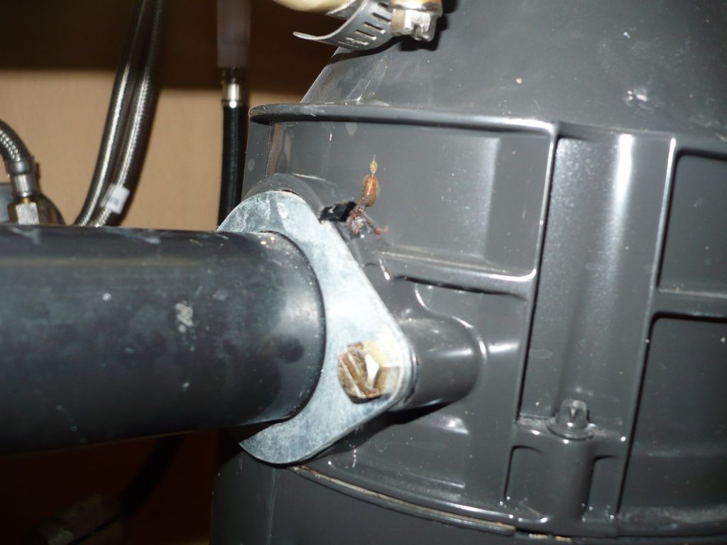 Cracked garbage disposal housing under kitchen sin