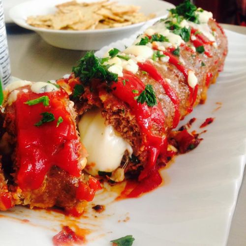 Gourmet meatloaf stuffed with gorgonzola cheese wh