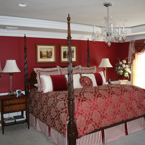 Dramatic master bedroom with custom bedding and dr
