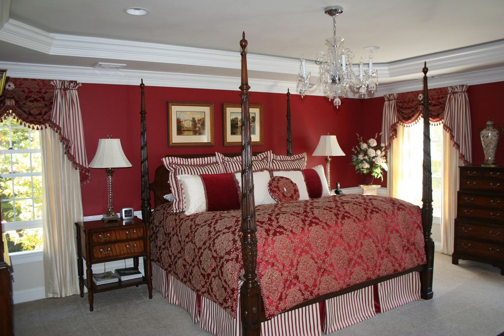 Dramatic master bedroom with custom bedding and dr