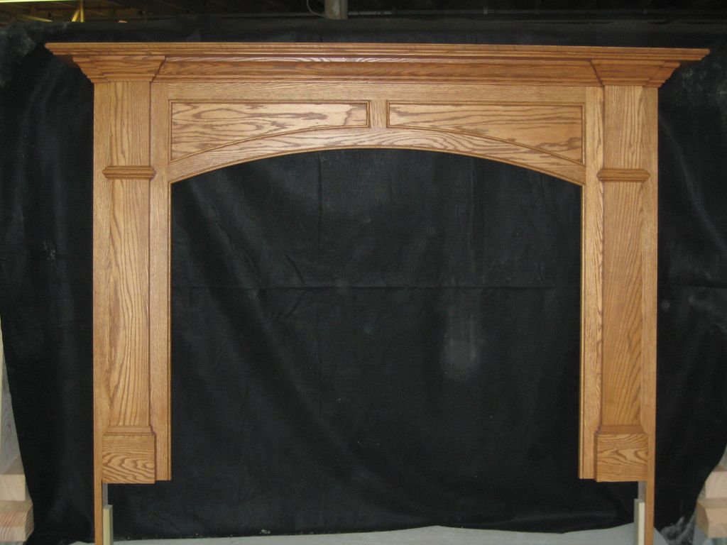 A beautiful oak custom fireplace mantle. The custo