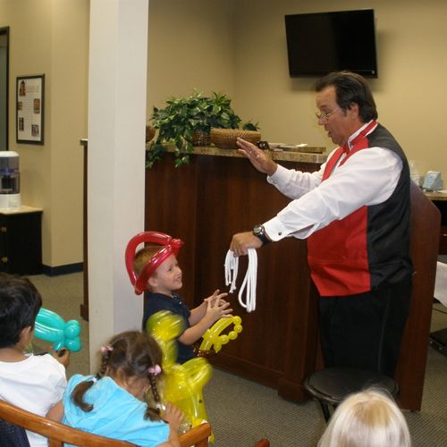 Magic and Company performing for youngsters