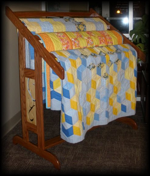 The design purpose of this quilt rack is to hold a