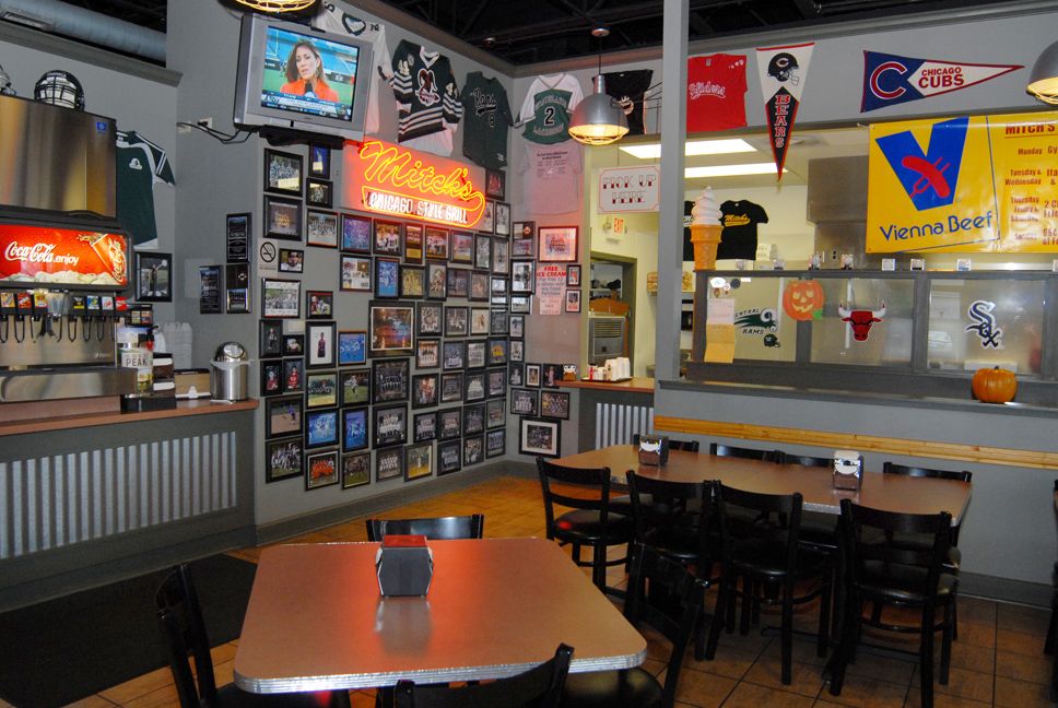 Mitch's wall of fame with dozens of pictures of lo