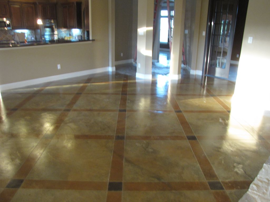 Acid stain slab flooring with decorative saw cut p