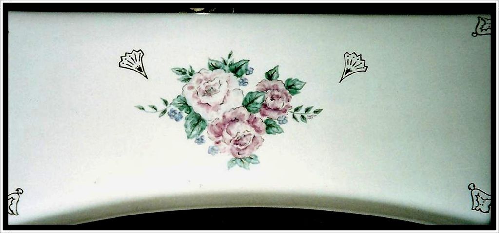 Toilet tank top painted to match basin