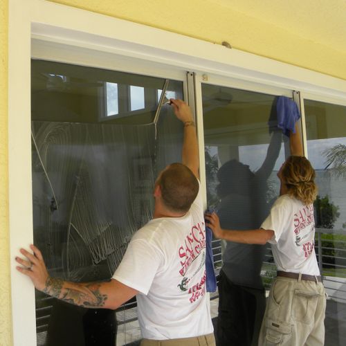 San-Cap Window Cleaning crew cleaning windows.