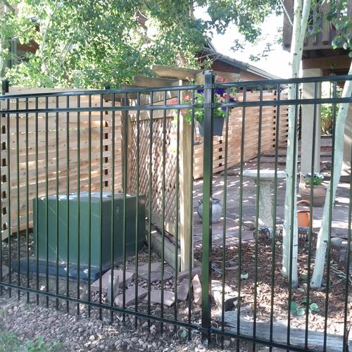6' basket weave fence and 6' ornamental iron fence