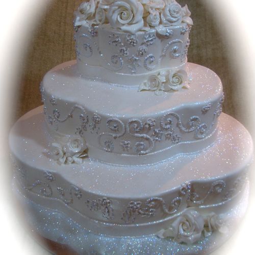 This cake matched the brides wedding gown details,
