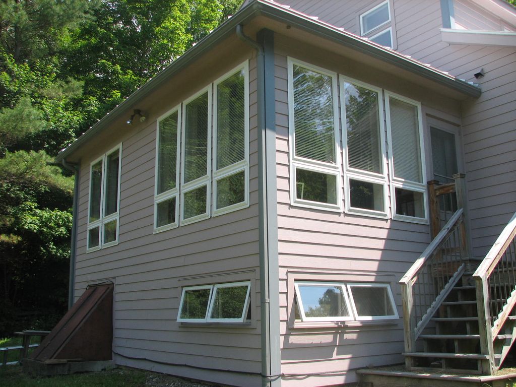 Sunroom/LR of custom built passive solar home in C