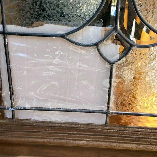 Broken leaded glass on door