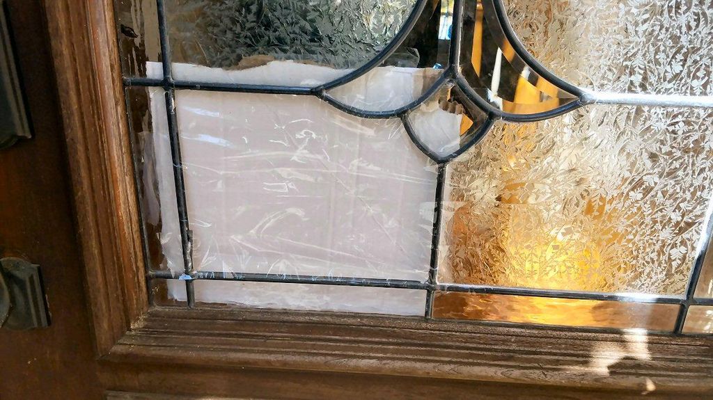 Broken leaded glass on door